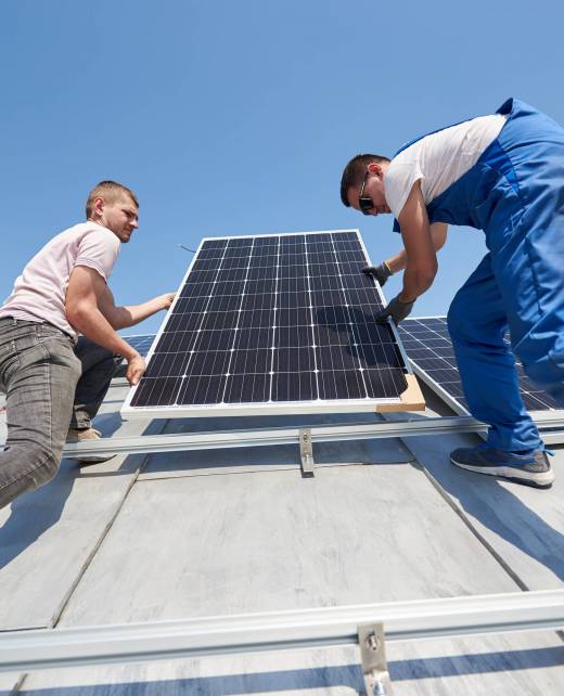 installing-solar-photovoltaic-panel-system-on-roof-2022-05-16-16-05-18-utc-min